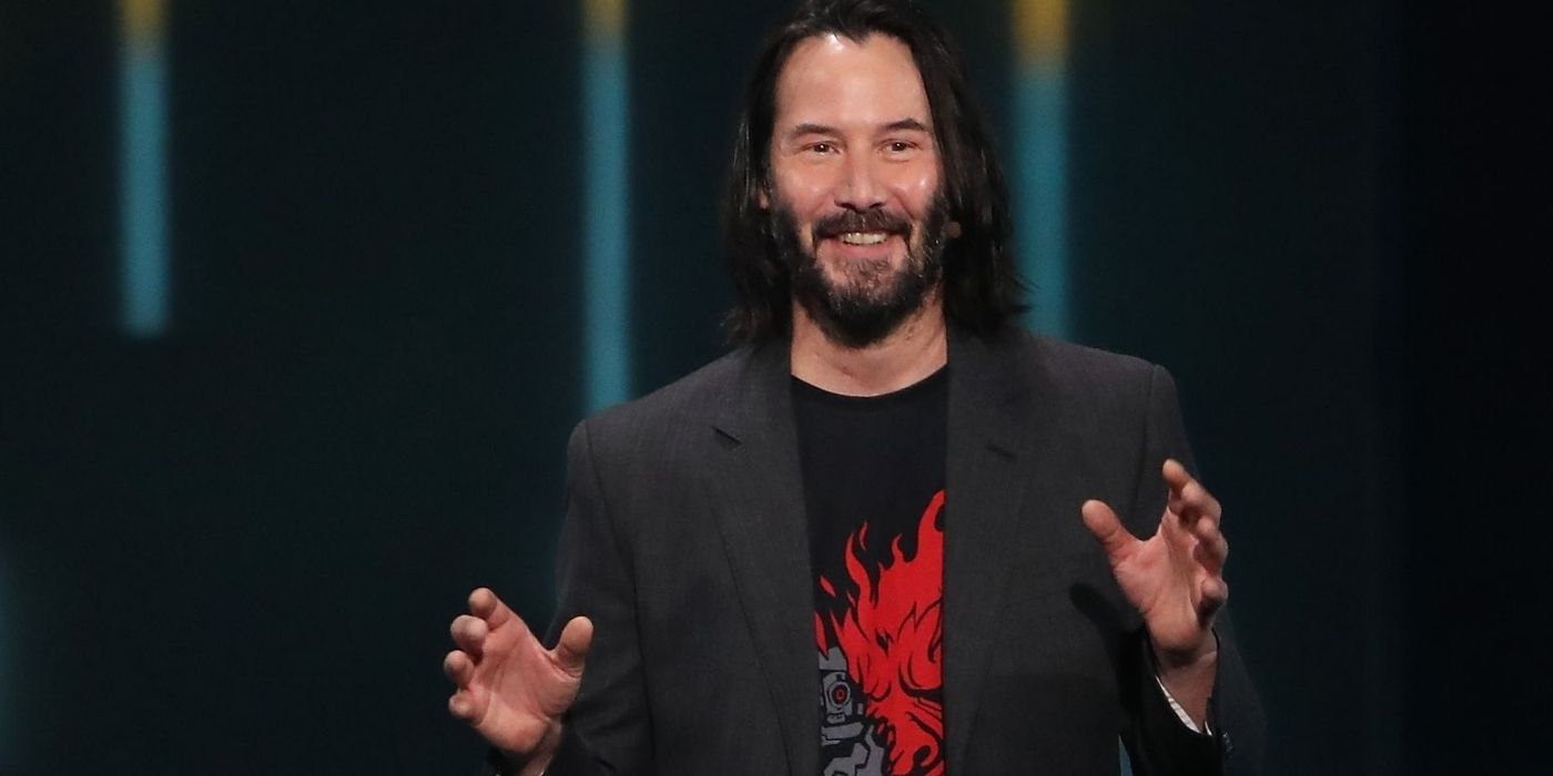 keanu reeves holding shirt