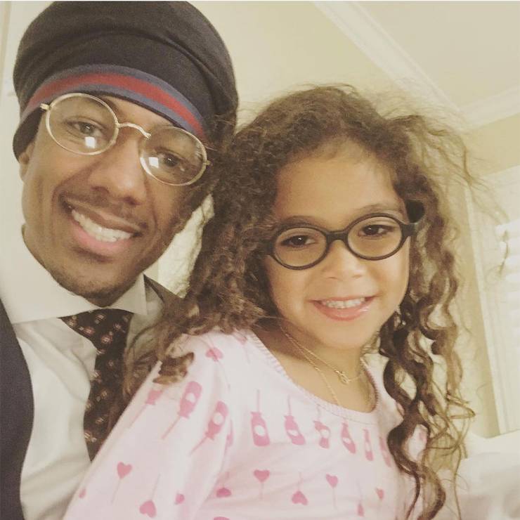 nick cannon and his daughter taking a selfie